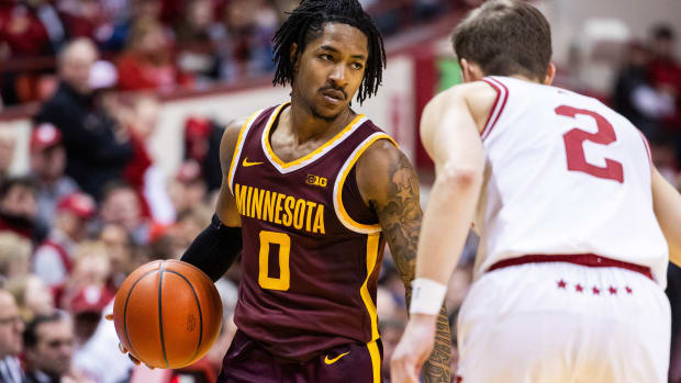 Elijah Hawkins dribbles